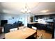 Kitchen with dark cabinets, modern appliances, and breakfast bar at 5905 S Kings Highway # 545-B, Myrtle Beach, SC 29575