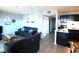 Comfortable living room with leather sofas and access to kitchen and balcony at 5905 S Kings Highway # 545-B, Myrtle Beach, SC 29575
