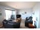 Living room with leather furniture, balcony access, and nautical decor at 5905 S Kings Highway # 545-B, Myrtle Beach, SC 29575