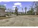 Gravel parking area with views of a rustic building at 6011 Dick Pond Rd., Myrtle Beach, SC 29588