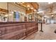 Long wooden bar with rustic interior and seating area at 6011 Dick Pond Rd., Myrtle Beach, SC 29588