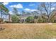 Landscaped yard with a winding pathway and mature trees at 6011 Dick Pond Rd., Myrtle Beach, SC 29588