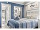 Bedroom with a twin bed and coastal decor at 6900 Ocean Blvd. N # 1443, Myrtle Beach, SC 29572