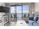 Living room with ocean view, balcony access, and comfortable seating at 6900 Ocean Blvd. N # 1443, Myrtle Beach, SC 29572