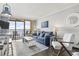 Open living room with ocean views and comfortable seating at 6900 Ocean Blvd. N # 1443, Myrtle Beach, SC 29572