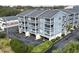 Condo building showcasing its exterior and surrounding landscape at 812 Ocean Blvd. S # B-1, Surfside Beach, SC 29575