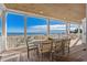 Oceanview deck with table and chairs for outdoor dining at 8702 N Ocean Blvd., Myrtle Beach, SC 29572