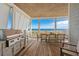 Oceanfront deck with built-in grill and dining area at 8702 N Ocean Blvd., Myrtle Beach, SC 29572