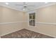 Cozy bedroom with window, ceiling fan and carpet at 918 Forest Loop, Conway, SC 29526