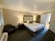 King-size bed, armchair, and access to closet and bathroom at 1105 S Ocean Blvd. # 334, Myrtle Beach, SC 29577