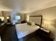 King-size bed, nightstands, and a comfortable armchair at 1105 S Ocean Blvd. # 334, Myrtle Beach, SC 29577