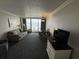 Living room with ocean view and comfortable seating at 1105 S Ocean Blvd. # 334, Myrtle Beach, SC 29577