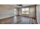 Bedroom with hardwood floors, large window and patio door at 1192 River Oaks Dr. # 28-B, Myrtle Beach, SC 29579