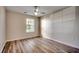 Well-lit bedroom with laminate flooring and ceiling fan at 1192 River Oaks Dr. # 28-B, Myrtle Beach, SC 29579