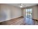 Bedroom with hardwood floors and sliding glass door at 1192 River Oaks Dr. # 28-B, Myrtle Beach, SC 29579