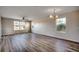 Bright dining room with hardwood floors and large windows at 1192 River Oaks Dr. # 28-B, Myrtle Beach, SC 29579