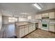 Eat-in kitchen with white cabinets and laminate flooring at 1192 River Oaks Dr. # 28-B, Myrtle Beach, SC 29579