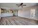 Living room with hardwood floors and access to kitchen at 1192 River Oaks Dr. # 28-B, Myrtle Beach, SC 29579