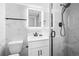Modern bathroom with white vanity, marble tile, and glass shower at 1210 N Waccamaw Dr. # 404, Garden City Beach, SC 29576