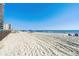 Relaxing beach view with umbrellas at 1210 N Waccamaw Dr. # 404, Garden City Beach, SC 29576