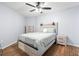 Cozy bedroom with light walls, wood floors, and ceiling fan at 1210 N Waccamaw Dr. # 404, Garden City Beach, SC 29576