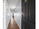 Condo hallway with wood floors and ocean view at 1210 N Waccamaw Dr. # 404, Garden City Beach, SC 29576