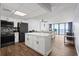 Modern kitchen with white cabinets and ocean view at 1210 N Waccamaw Dr. # 404, Garden City Beach, SC 29576