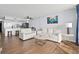 Spacious living room featuring plush sofas and hardwood floors at 1210 N Waccamaw Dr. # 404, Garden City Beach, SC 29576