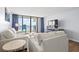 Living room with ocean view and comfy seating at 1210 N Waccamaw Dr. # 404, Garden City Beach, SC 29576