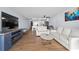 Bright living room with comfortable seating, hardwood floors, and ocean views at 1210 N Waccamaw Dr. # 404, Garden City Beach, SC 29576