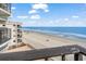 Relaxing oceanfront view from balcony, beach and building view at 1210 N Waccamaw Dr. # 404, Garden City Beach, SC 29576