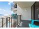 Balcony view showcasing ocean, beach, and resort pool at 1210 N Waccamaw Dr. # 404, Garden City Beach, SC 29576