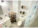 Bathroom with toilet, sink, shower, and shelf at 202 75Th Ave N # 5704/5705, Myrtle Beach, SC 29572