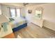 King bedroom with dresser, TV, and access to balcony at 202 75Th Ave N # 5704/5705, Myrtle Beach, SC 29572