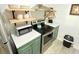 Updated kitchen with stainless steel appliances and light teal cabinets at 202 75Th Ave N # 5704/5705, Myrtle Beach, SC 29572
