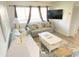 Comfortable living room with sofa, coffee table, and coastal rug at 202 75Th Ave N # 5704/5705, Myrtle Beach, SC 29572