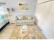 Cozy living room with a sofa, a coffee table, and a beach-themed rug at 202 75Th Ave N # 5704/5705, Myrtle Beach, SC 29572