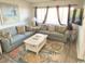 Relaxing living room with two sofas and a coffee table at 202 75Th Ave N # 5704/5705, Myrtle Beach, SC 29572