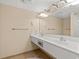 Double vanity bathroom with updated fixtures and tile floor at 2501 S Ocean Blvd. # 1111, Myrtle Beach, SC 29577