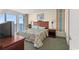 Comfortable bedroom with a queen bed and ocean views at 2501 S Ocean Blvd. # 1111, Myrtle Beach, SC 29577