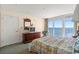 Bedroom with a queen bed and access to a balcony with ocean views at 2501 S Ocean Blvd. # 1111, Myrtle Beach, SC 29577