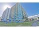 Beachfront building exterior; lush lawn and walkway at 2501 S Ocean Blvd. # 1111, Myrtle Beach, SC 29577