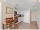 Small galley kitchen with white cabinets and standard appliances at 2501 S Ocean Blvd. # 1111, Myrtle Beach, SC 29577