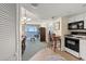Small galley kitchen with white cabinets and standard appliances at 2501 S Ocean Blvd. # 1111, Myrtle Beach, SC 29577
