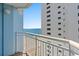 Breathtaking ocean view from private balcony; sandy beach and neighboring building visible at 2501 S Ocean Blvd. # 1111, Myrtle Beach, SC 29577