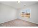 Bright bedroom featuring a large window and carpet at 332 Hayloft Circle, Conway, SC 29526