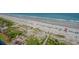 Aerial view of a beach with colorful umbrellas and people at 6804 N Ocean Blvd. # 1147, Myrtle Beach, SC 29572