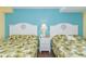 Bedroom with two twin beds and white wood headboards at 6804 N Ocean Blvd. # 1147, Myrtle Beach, SC 29572