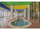 Indoor pool and hot tub area with colorful decor at 6804 N Ocean Blvd. # 1147, Myrtle Beach, SC 29572