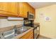 Bright kitchen with stainless steel appliances and wood cabinets at 6804 N Ocean Blvd. # 1147, Myrtle Beach, SC 29572